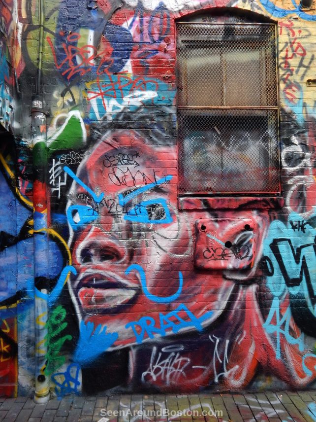 cambridge street art red face in modica way